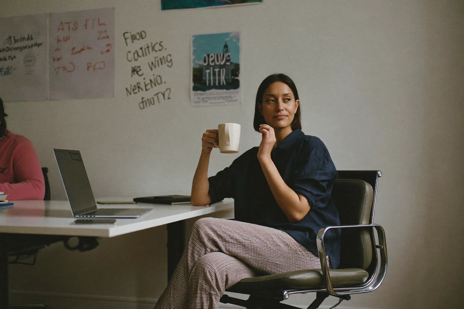 Marketer relaxed in front of a tidy campaign wall